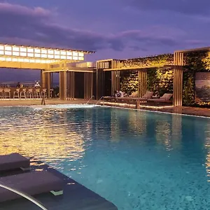 Отель Okura Manila At Newport World